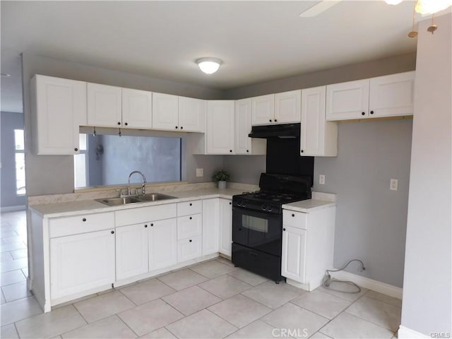 kitchen with black range with gas stovetop, white cabinetry, sink, and light tile patterned flooring