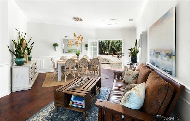 living room featuring dark hardwood / wood-style flooring and ornamental molding