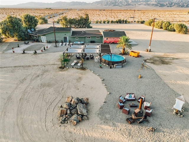 birds eye view of property featuring a mountain view