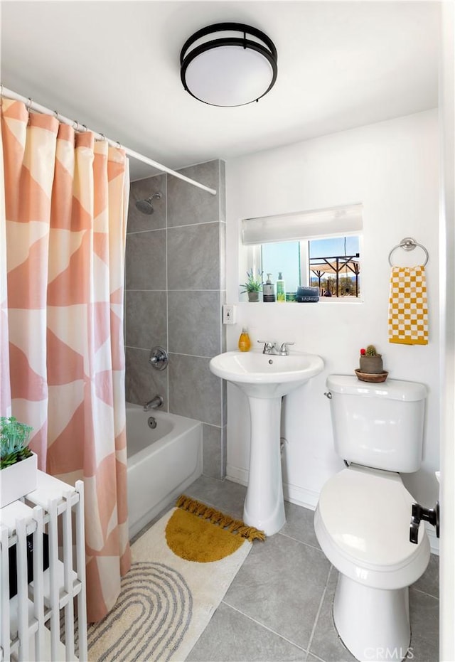 full bathroom with tile patterned floors, sink, shower / tub combo, and toilet