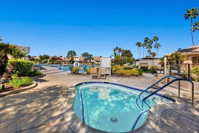 view of swimming pool featuring a patio area