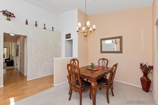 dining room featuring a chandelier and light wood-type flooring