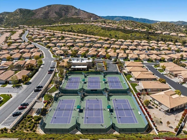 birds eye view of property with a mountain view