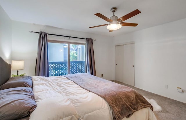 bedroom with ceiling fan, carpet floors, access to outside, and a closet