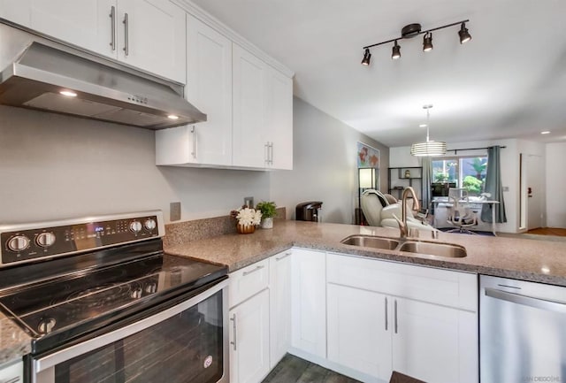 kitchen with sink, hanging light fixtures, stainless steel appliances, dark hardwood / wood-style floors, and white cabinets