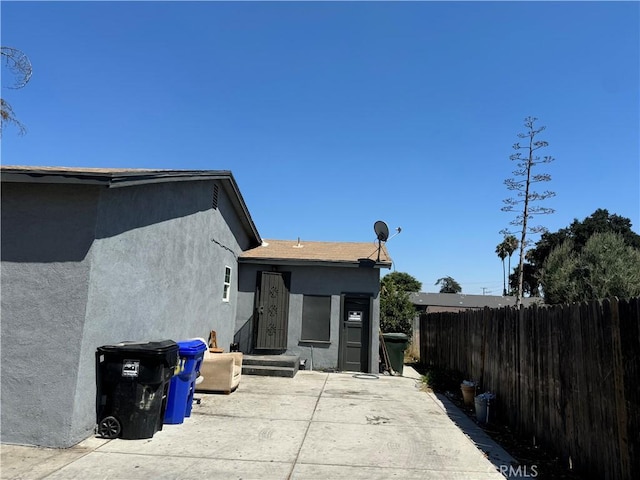 back of property featuring a patio