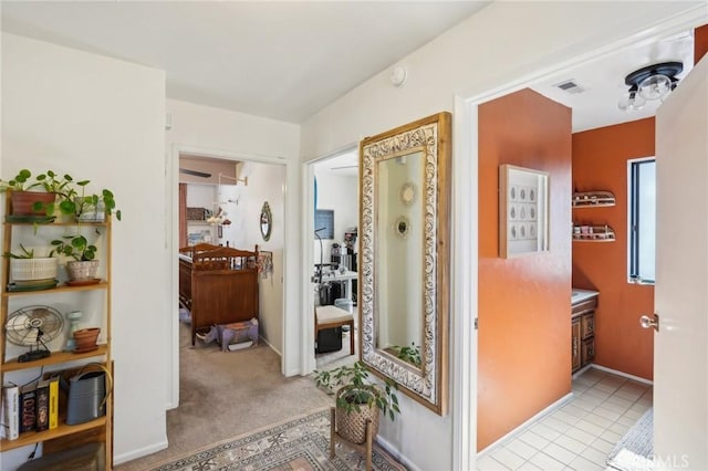 hallway with light carpet