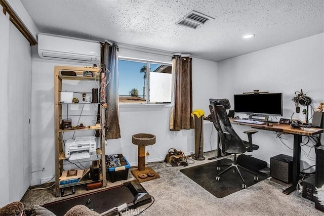 carpeted home office featuring a wall mounted air conditioner and a textured ceiling