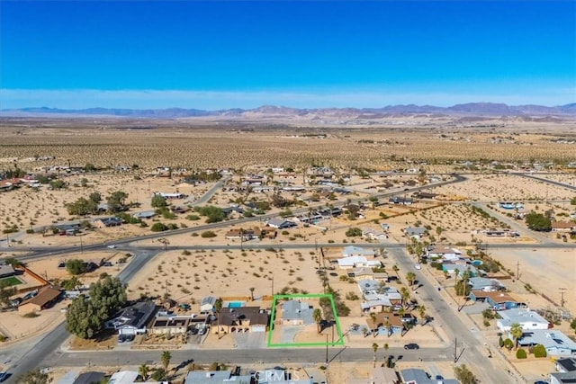 birds eye view of property featuring a mountain view