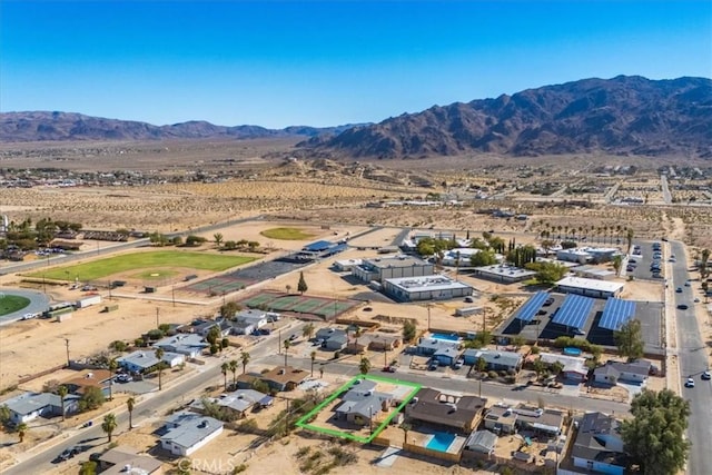 birds eye view of property featuring a mountain view