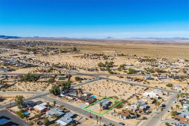 birds eye view of property featuring a mountain view