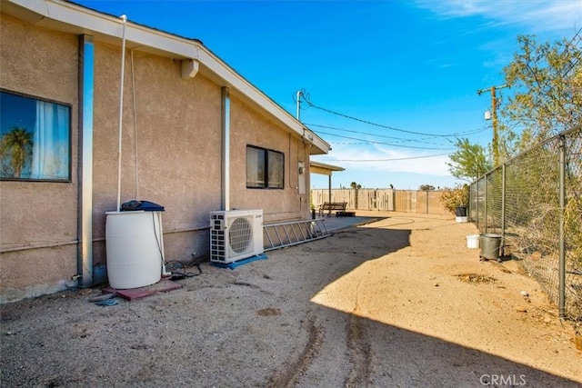 view of home's exterior with ac unit