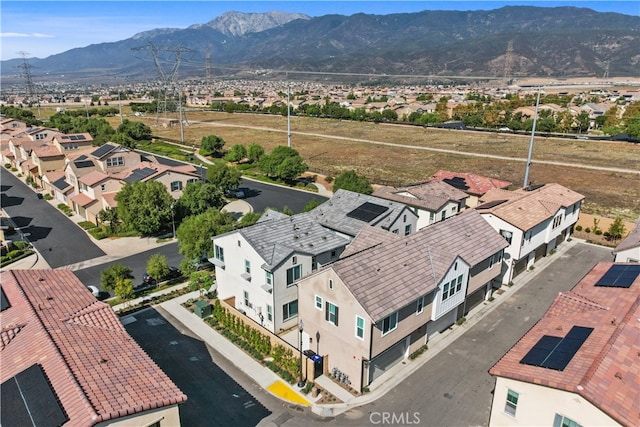 birds eye view of property featuring a mountain view