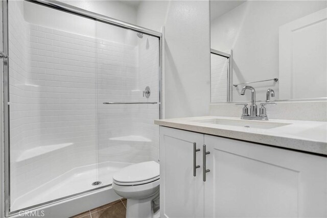 15974 Jamie Ln Unit 1, Fontana, CA 92336 - bathroom featuring toilet, a stall shower, and vanity