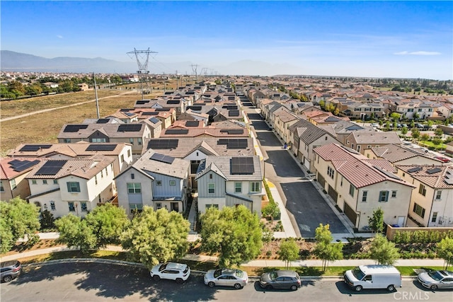 birds eye view of property with a mountain view