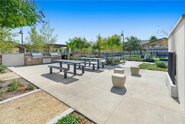 15974 Jamie Ln Unit 1, Fontana, CA 92336 - view of property's community featuring an outdoor kitchen, fence, and a patio