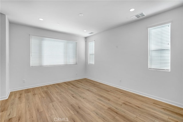 unfurnished room featuring light hardwood / wood-style flooring