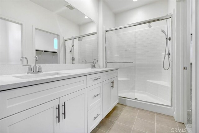 15974 Jamie Ln Unit 1, Fontana, CA 92336 - bathroom with tile patterned floors, a shower stall, double vanity, and recessed lighting