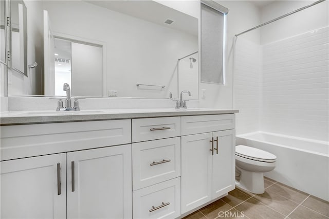 full bathroom with vanity, toilet, tile patterned flooring, and tub / shower combination