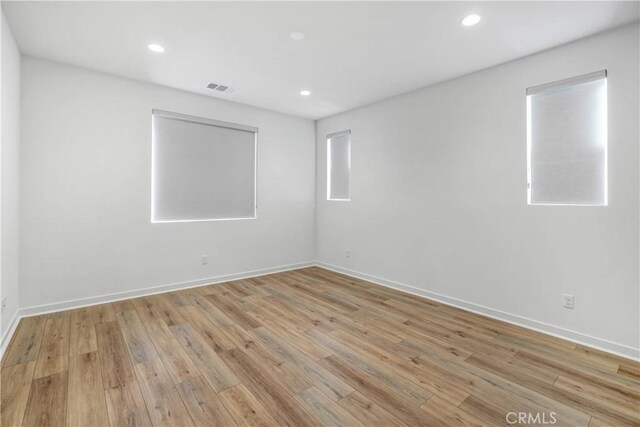 15974 Jamie Ln Unit 1, Fontana, CA 92336 - spare room with light wood-type flooring, recessed lighting, and baseboards