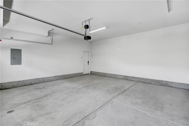 garage featuring a garage door opener and electric panel