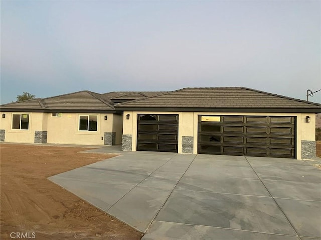 prairie-style home featuring a garage