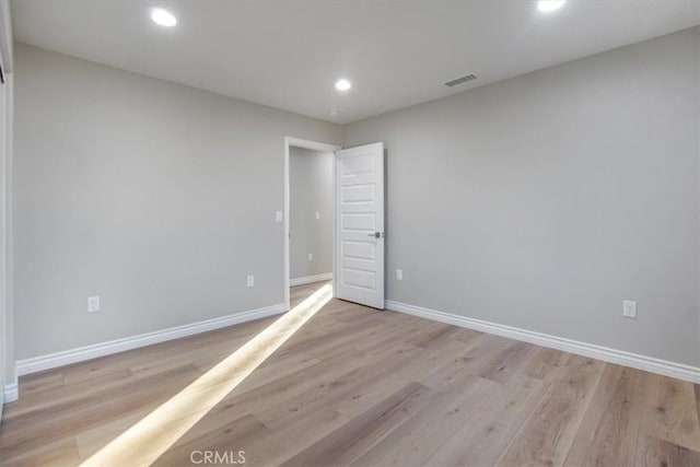 unfurnished room featuring light hardwood / wood-style floors