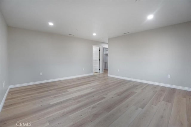 unfurnished room with light hardwood / wood-style flooring