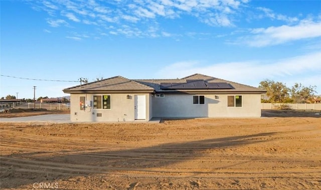 view of front of house with solar panels