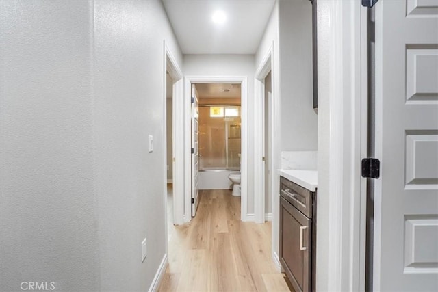 corridor featuring light hardwood / wood-style floors