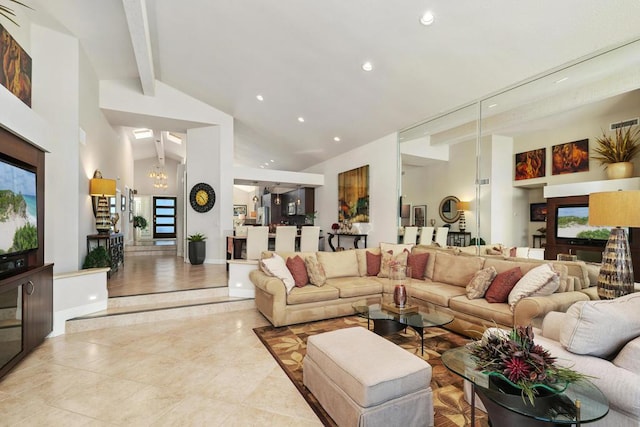 tiled living room with beam ceiling, high vaulted ceiling, and an inviting chandelier