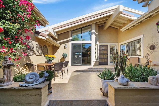 doorway to property featuring a patio area