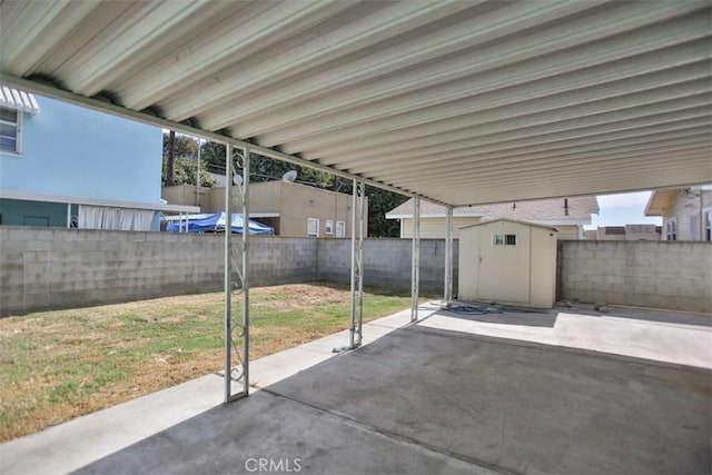 view of patio / terrace with a shed