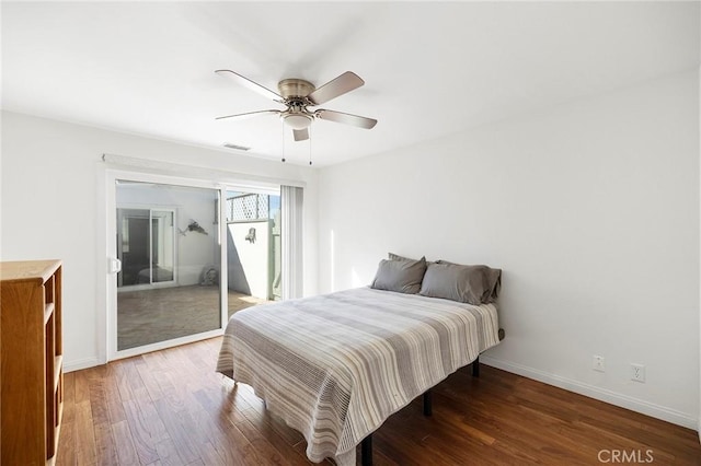 bedroom featuring a closet, ceiling fan, and dark hardwood / wood-style flooring