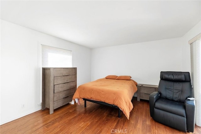 bedroom with hardwood / wood-style floors