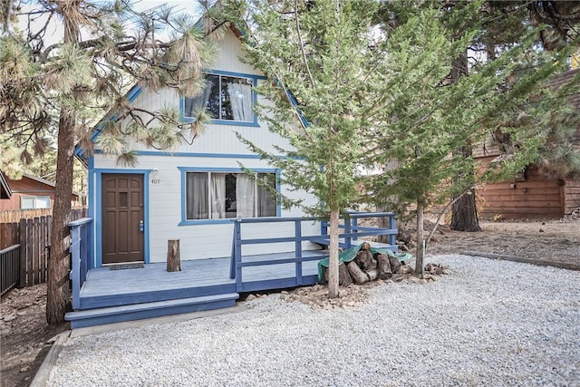 view of front of home with a wooden deck