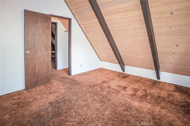 additional living space with vaulted ceiling with beams, wooden ceiling, and carpet flooring