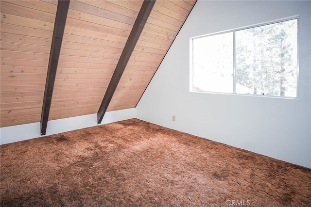 bonus room with carpet floors, lofted ceiling with beams, and wooden ceiling