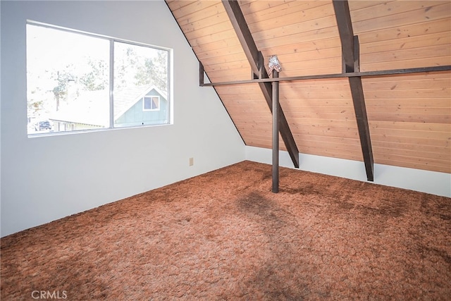 interior space with beam ceiling, wood ceiling, and carpet flooring