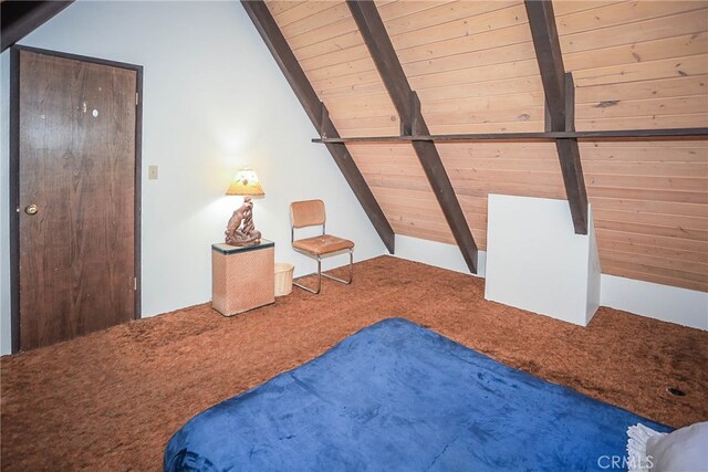 unfurnished bedroom featuring wooden ceiling, carpet floors, and vaulted ceiling with beams