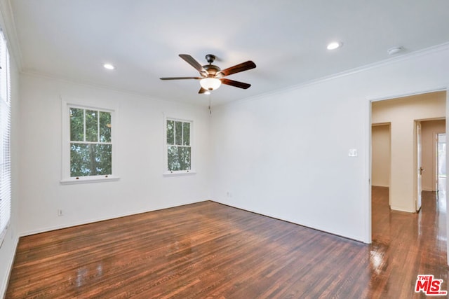 unfurnished room with ceiling fan, ornamental molding, and dark wood-type flooring