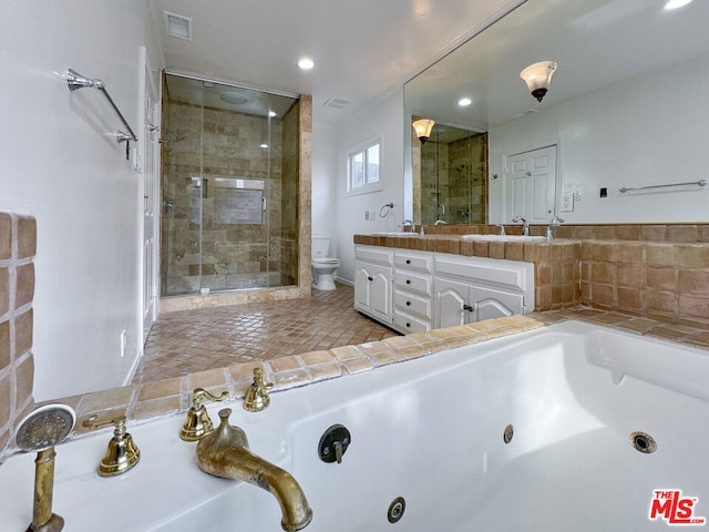 full bathroom featuring vanity, toilet, and shower with separate bathtub