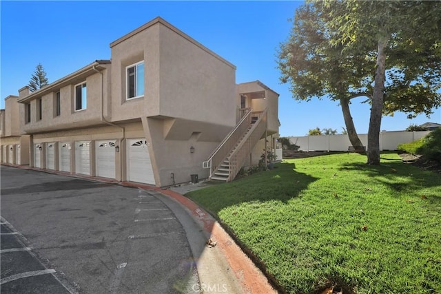 exterior space with a garage and a yard