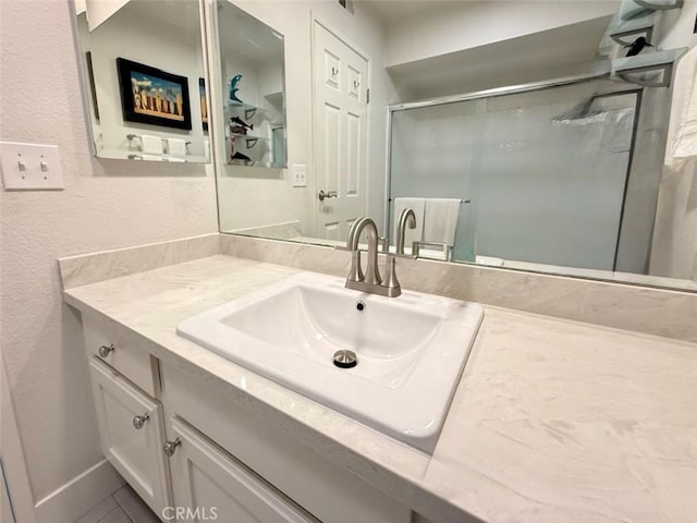 bathroom with vanity and walk in shower