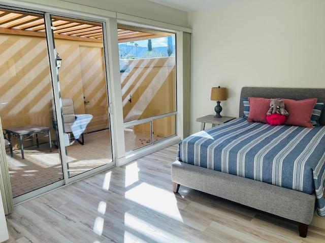 bedroom with wood-type flooring