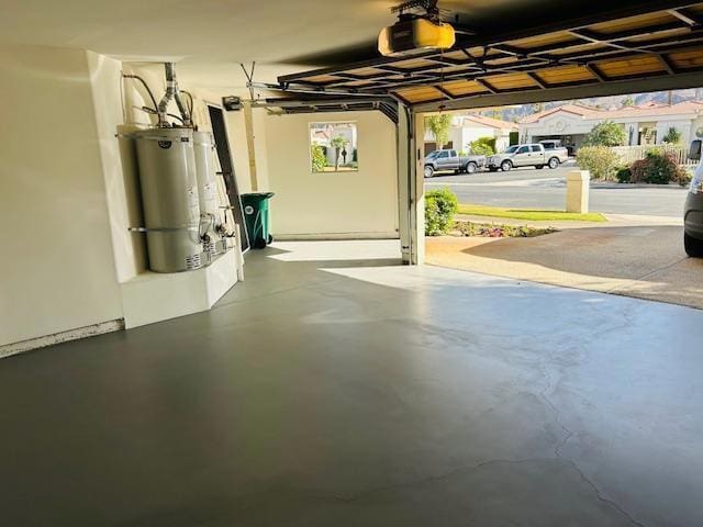 garage with a garage door opener and water heater