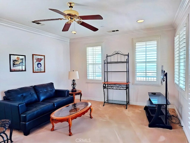 living room featuring plenty of natural light, ornamental molding, and ceiling fan