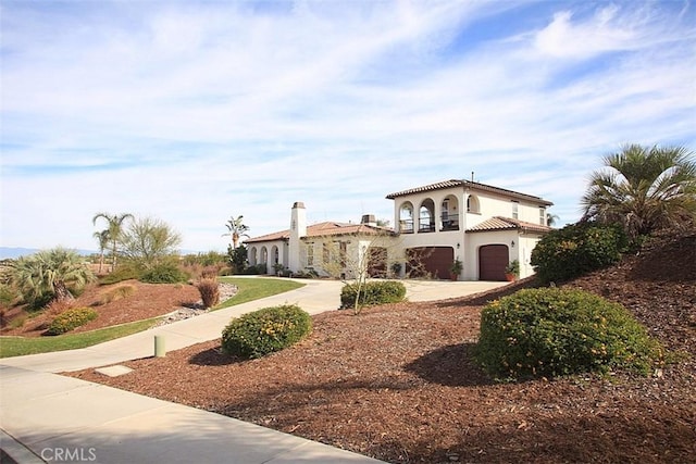 mediterranean / spanish-style house featuring a garage