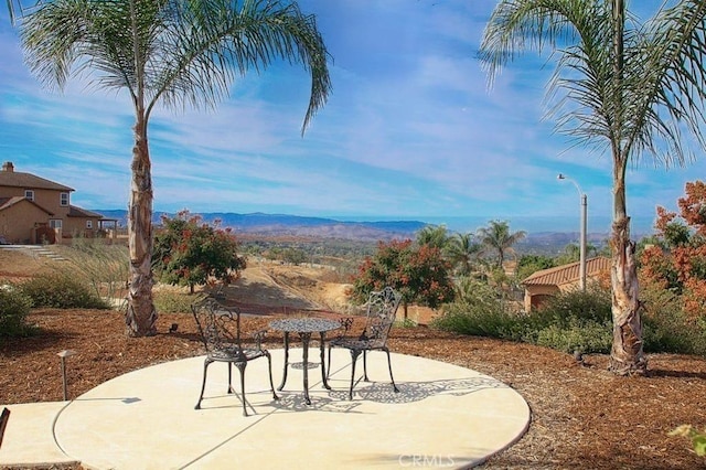 view of patio / terrace featuring a mountain view