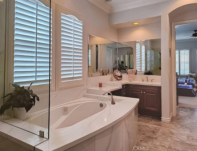 bathroom with vanity, ceiling fan, ornamental molding, and a bath